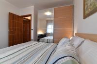 Postel nebo postele na pokoji v ubytování City penthouse Vita