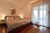 Postel nebo postele na pokoji v ubytování City penthouse Vita