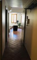 a hallway with a room with a tub in the distance at Appartement coeur du vieux Nice in Nice
