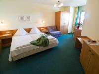 Posteľ alebo postele v izbe v ubytovaní Aparthotel Alpina