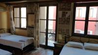 Posteľ alebo postele v izbe v ubytovaní Kydonia Rooms