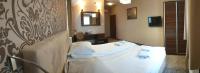 Posteľ alebo postele v izbe v ubytovaní Hotel Kamiza