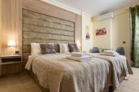 Posteľ alebo postele v izbe v ubytovaní Seven Heaven Premium Suites