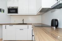 Kuchyňa alebo kuchynka v ubytovaní Jantar Apartamenty - Park Side