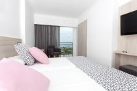 Postel nebo postele na pokoji v ubytování Hotel Timor