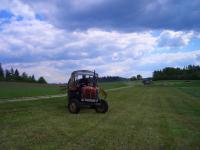 a person driving a tractor in a field at Bauernhof Familie Tauber-Scheidl in Grossmeinharts