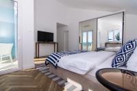 Posteľ alebo postele v izbe v ubytovaní Seafront Luxury Apartments Fun