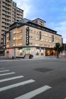 a large building on the corner of a street at Forward Hotel Taipei Nangang in Taipei