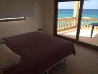 A bed or beds in a room at Maison Ses Covetes