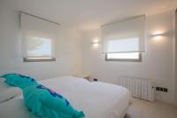 A bed or beds in a room at Maison Ses Covetes