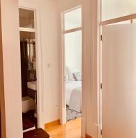 Postel nebo postele na pokoji v ubytování Apartments Alfacinha Ajuda