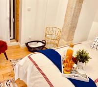 Postel nebo postele na pokoji v ubytování Apartments Alfacinha Ajuda