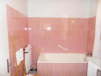 a pink bathroom with a tub and a sink at Chambres d&#39;hôtes d&#39;Accolay in Accolay