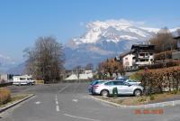 a parking lot with a snow covered mountain in the background at Hotel Val Joly in Saint-Gervais-les-Bains