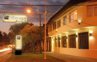 a building with a sign on the side of a street at Hotel Libertador Bernardo O´Higgins in Chillán