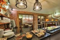 a kitchen with a buffet of food on a counter at Hotel&SPA Jawor in Zawoja