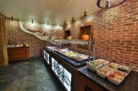 a kitchen with a buffet of food on a brick wall at Hotel&SPA Jawor in Zawoja
