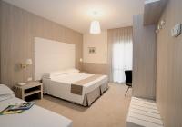 A bed or beds in a room at Hotel Atlantico