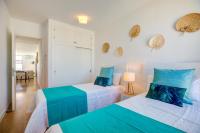 Postel nebo postele na pokoji v ubytování Beachfront Apartment Sivella by Sealand Villas