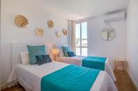 Postel nebo postele na pokoji v ubytování Beachfront Apartment Sivella by Sealand Villas