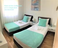 Posteľ alebo postele v izbe v ubytovaní Apartments Town