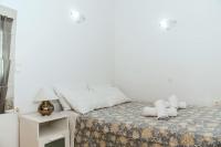 A bed or beds in a room at Nikis Apartment