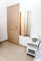 A bed or beds in a room at Nikis Apartment
