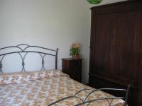 A bed or beds in a room at La Fattoria