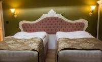 A bed or beds in a room at Yildiz Life Hotel