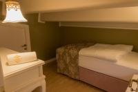 A bed or beds in a room at Yildiz Life Hotel