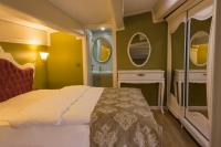 A bed or beds in a room at Yildiz Life Hotel