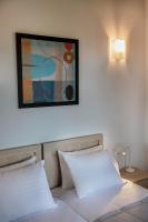 Postel nebo postele na pokoji v ubytování Androulakis Apartments