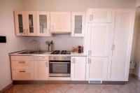 A kitchen or kitchenette at Kelly Apartments Cefalù