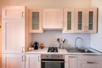 A kitchen or kitchenette at Kelly Apartments Cefalù