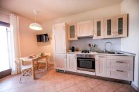 A kitchen or kitchenette at Kelly Apartments Cefalù