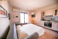 A kitchen or kitchenette at Kelly Apartments Cefalù