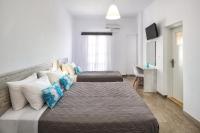 Postel nebo postele na pokoji v ubytování Villa Kavallaris & Apartments