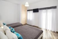 Postel nebo postele na pokoji v ubytování Villa Kavallaris & Apartments