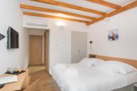 Posteľ alebo postele v izbe v ubytovaní Rooms Kala