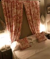 A bed or beds in a room at Capri Moon Guest House