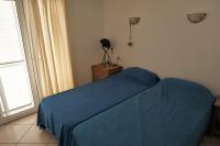 A bed or beds in a room at DELMAR