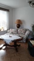 a living room with a couch and a table at 5 Gartenstraße in Angermünde