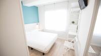 Postel nebo postele na pokoji v ubytování Happy Hostal Carrales