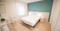 Postel nebo postele na pokoji v ubytování Happy Hostal Carrales