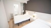 Postel nebo postele na pokoji v ubytování Happy Hostal Carrales