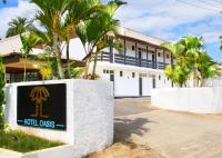 a hotel costs sign in front of a building at Hotel Oasis in Nadi
