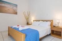 Posteľ alebo postele v izbe v ubytovaní Natsios Apartments