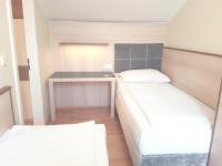 A bed or beds in a room at Hotel Haydn