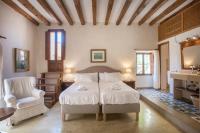 Posteľ alebo postele v izbe v ubytovaní Sa Bisbal - Turismo de interior