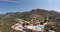 an aerial view of a resort with a mountain at Kolokotronis Hotel &amp; Spa in Stoupa